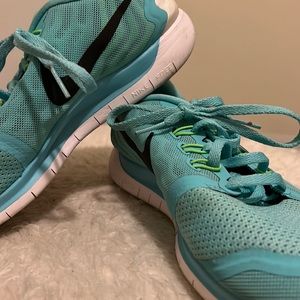 Blue and green Nike sneakers